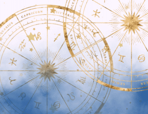 two gold zodiac wheels floating in dark blue smoke