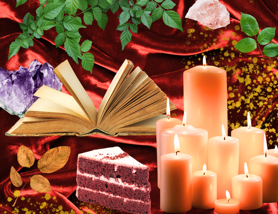 a large sheet or red velvet with candles, crystals, leaves and a slice of red velvet cake son top of it